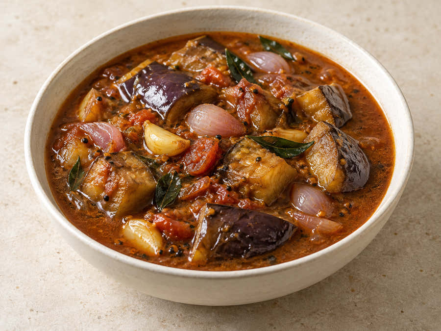 Brinjal and shallots in tamarind curry with curry leaves