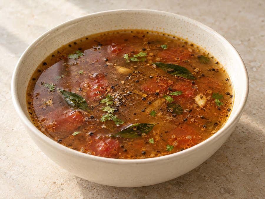 Thin pepper tomato rasam with cumin and curry leaves